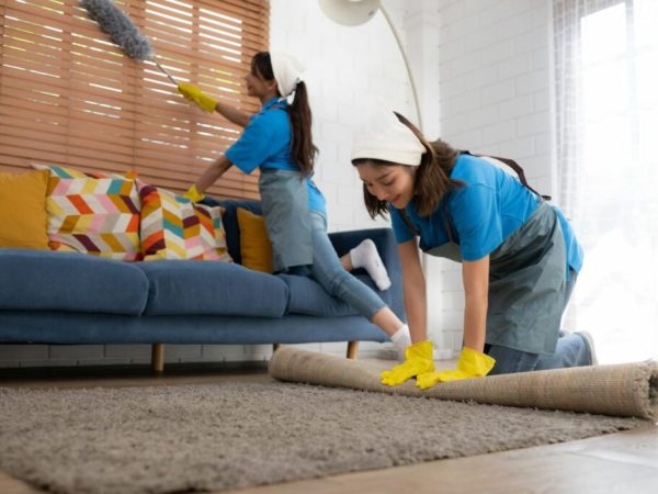 young-women-cleaning-maid-in-uniform-and-rubber-gloves-are-cleaning-the-room-fold-up-carpet-1024x682-1